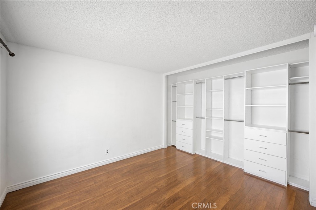 10475 Newhome Avenue, Unit 6 Sunland, CA 91040 - Photo 23 of 28 wooden floor and cabinet in a room