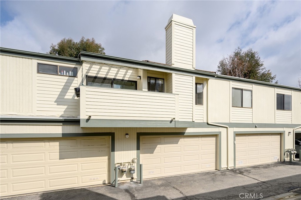 10475 Newhome Avenue, Unit 6 Sunland, CA 91040 - Photo 26 of 28 a view of a house with a garage