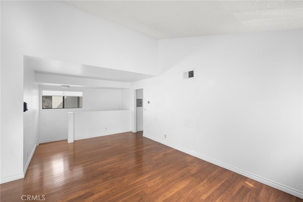 10475 Newhome Avenue, Unit 6 Sunland, CA 91040 - Photo 10 of 28 a view of empty room with wooden floor