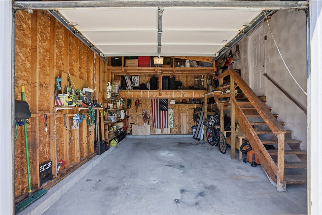 26 King Street Coventry, RI 02816 - Photo 4 of 50 Garage neatly organized with lots of storage and shelving