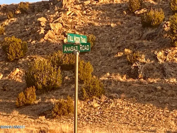a street sign that is on a tree