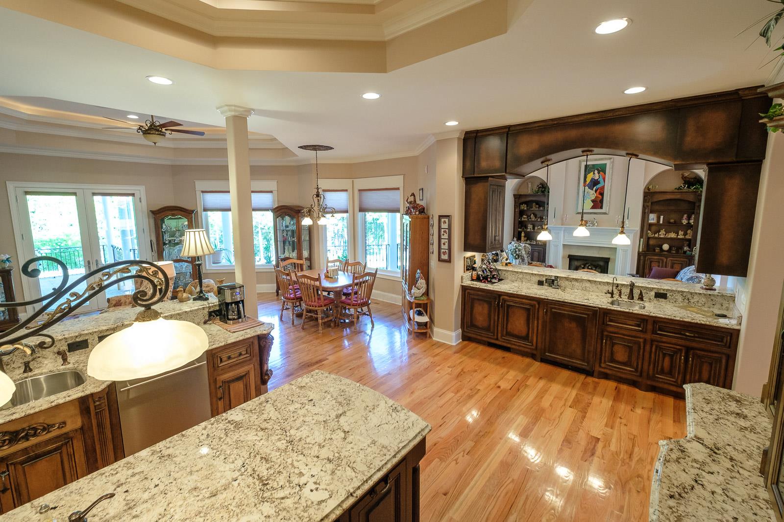 247 Canoe Branch Road Lebanon, TN 37087 - Photo 11 of 30 a large kitchen with kitchen island a sink a stove and a dining table view