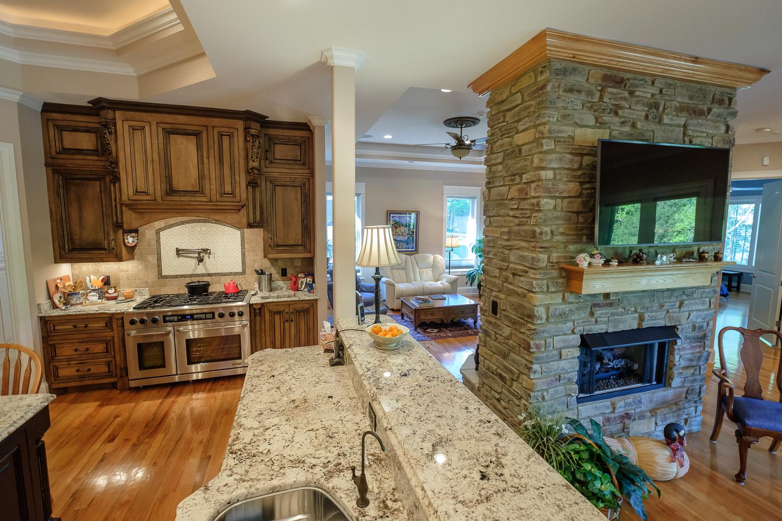 247 Canoe Branch Road Lebanon, TN 37087 - Photo 13 of 30 a kitchen with stainless steel appliances granite countertop a stove top oven and a view of living room