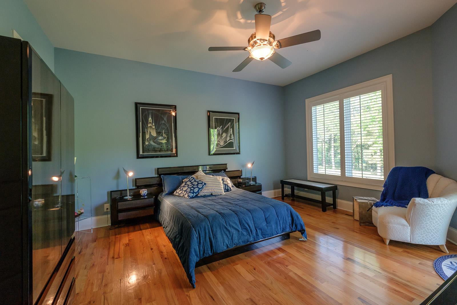 247 Canoe Branch Road Lebanon, TN 37087 - Photo 19 of 30 a bedroom with a bed couches chair and a large window