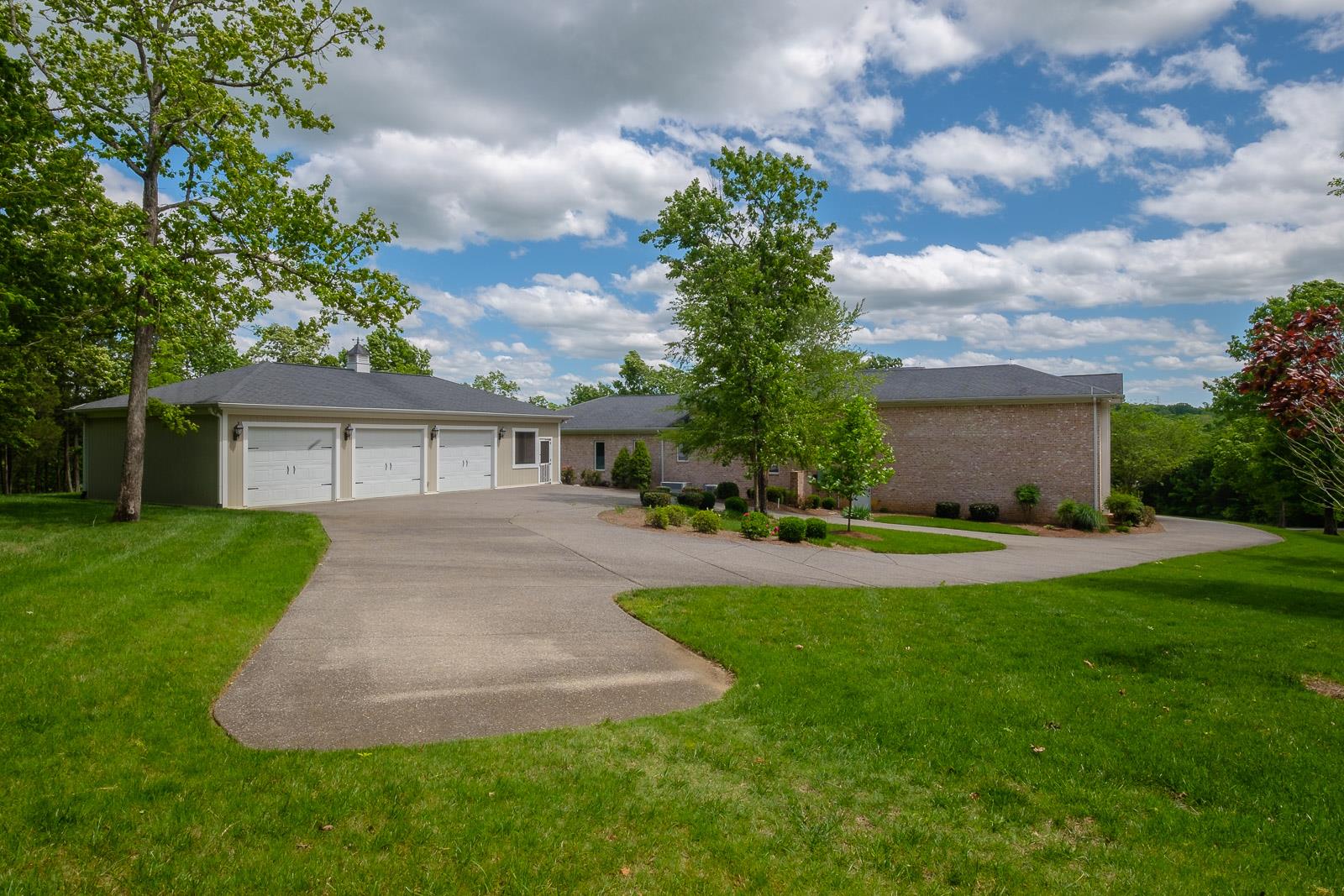 247 Canoe Branch Road Lebanon, TN 37087 - Photo 26 of 30 a front view of a house with a yard and a garage