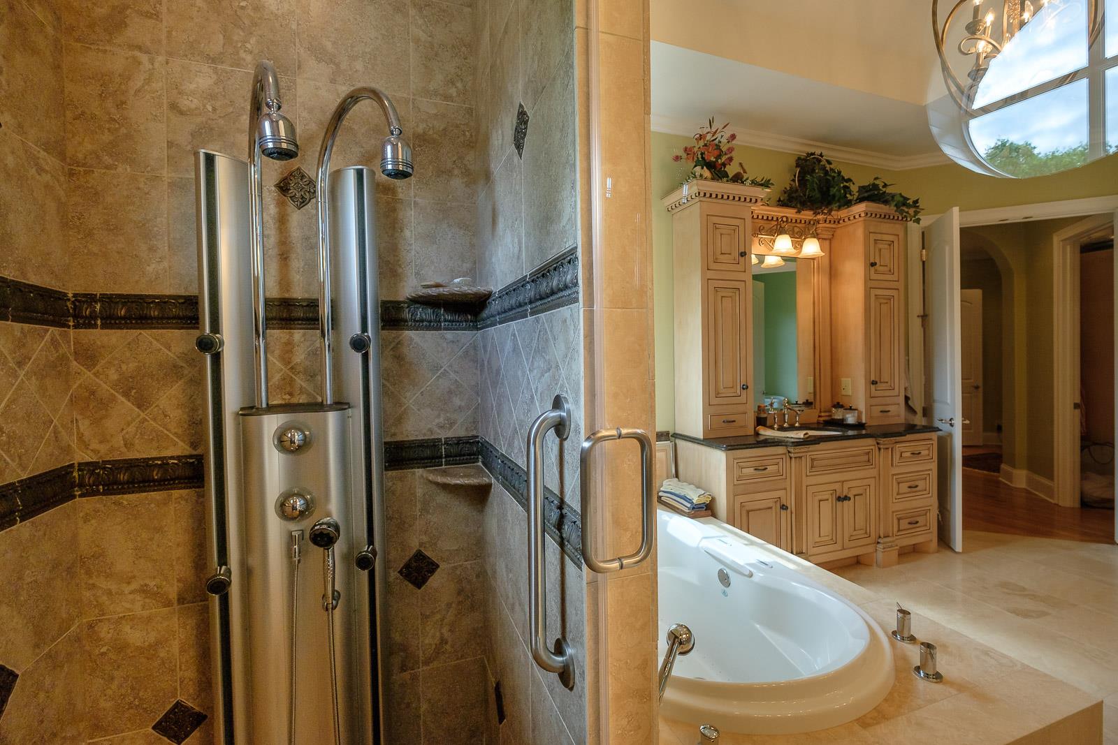 247 Canoe Branch Road Lebanon, TN 37087 - Photo 6 of 30 a bathroom with a granite countertop sink mirror toilet and bathtub
