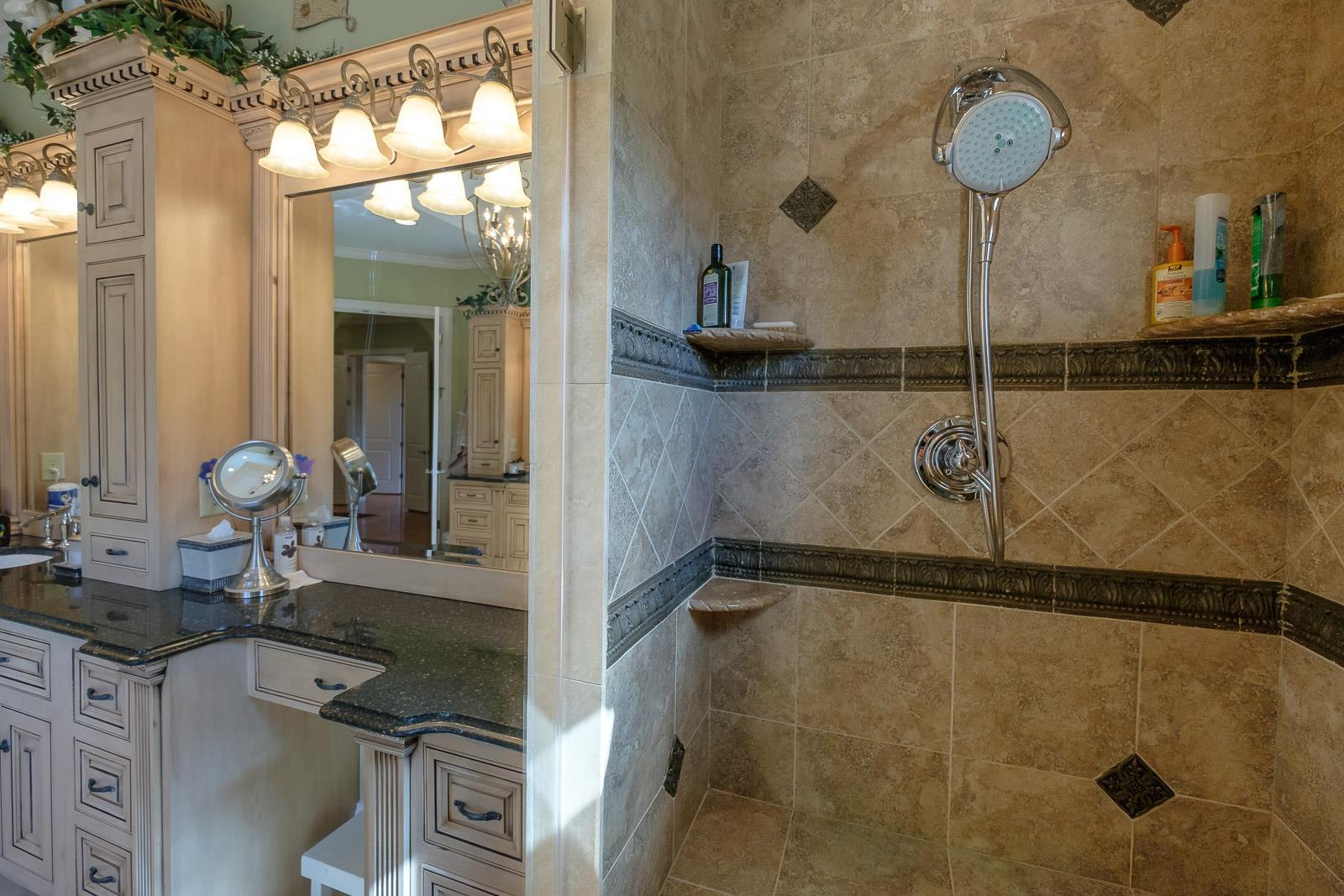 247 Canoe Branch Road Lebanon, TN 37087 - Photo 8 of 30 a bathroom with a granite countertop sink mirror and vanity