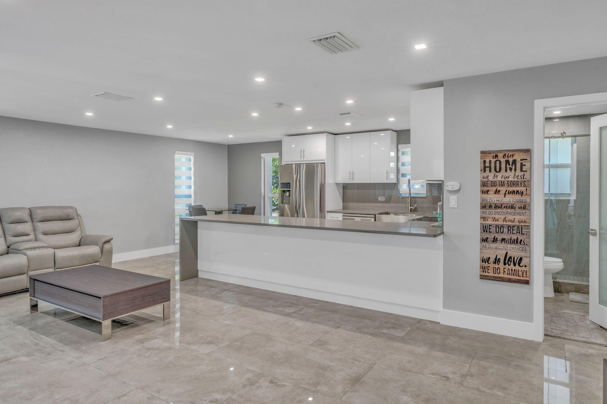 222 2nd Road Key Largo, FL 33037 - Photo 12 of 43 a living room with stainless steel appliances kitchen island granite countertop furniture and a view of kitchen