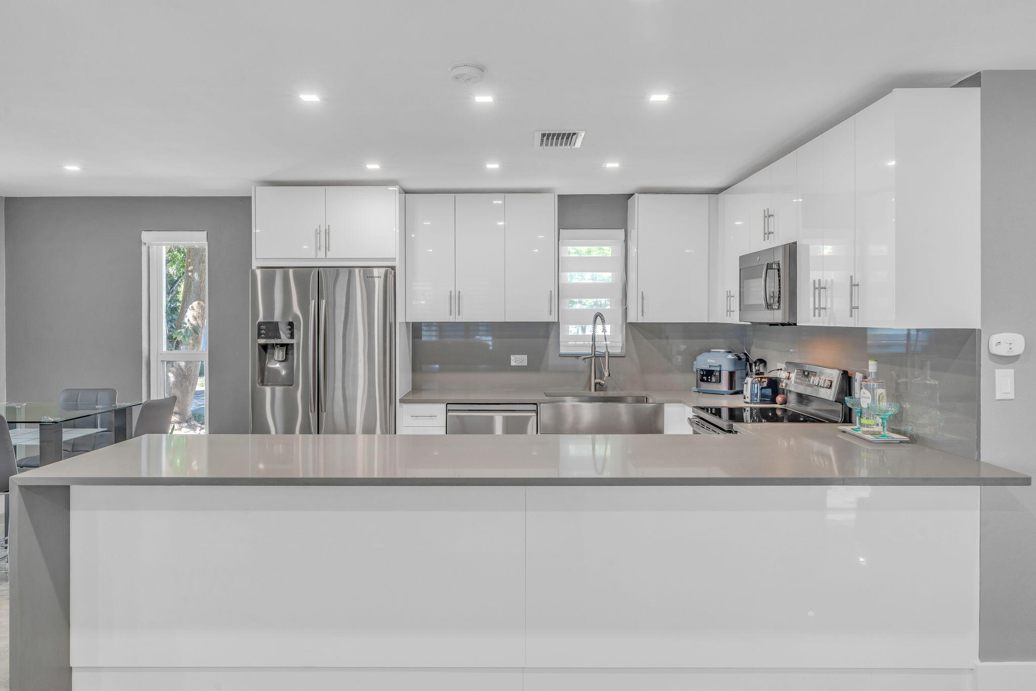 222 2nd Road Key Largo, FL 33037 - Photo 13 of 43 a kitchen with stainless steel appliances granite countertop a refrigerator and a sink