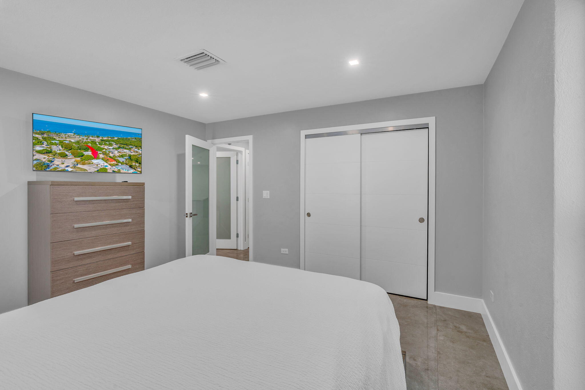 222 2nd Road Key Largo, FL 33037 - Photo 16 of 43 a bedroom with a large bed and a cabinets