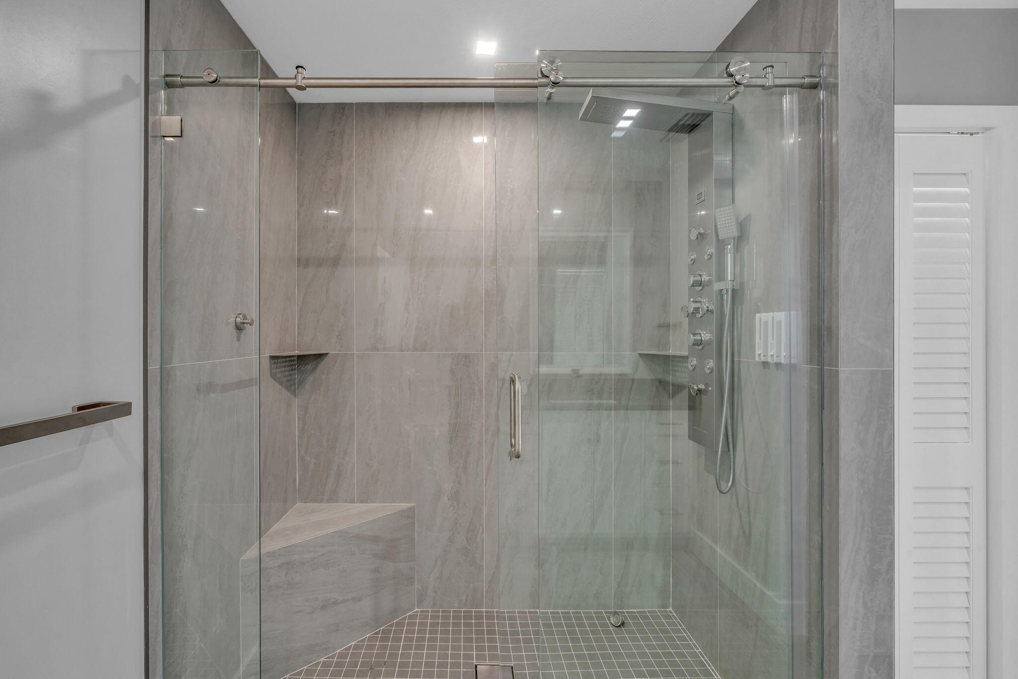 222 2nd Road Key Largo, FL 33037 - Photo 24 of 43 a bathroom with a glass shower door