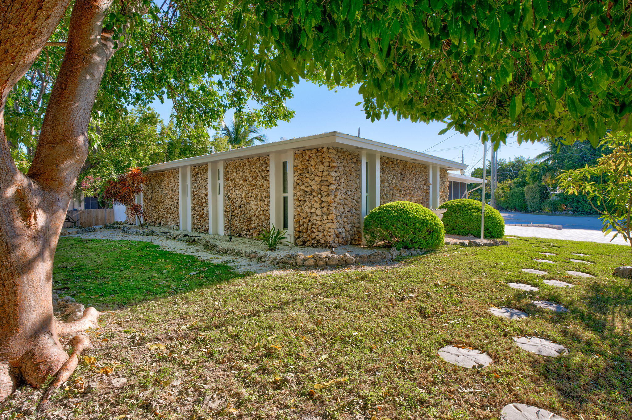222 2nd Road Key Largo, FL 33037 - Photo 25 of 43 a front view of a house with garden