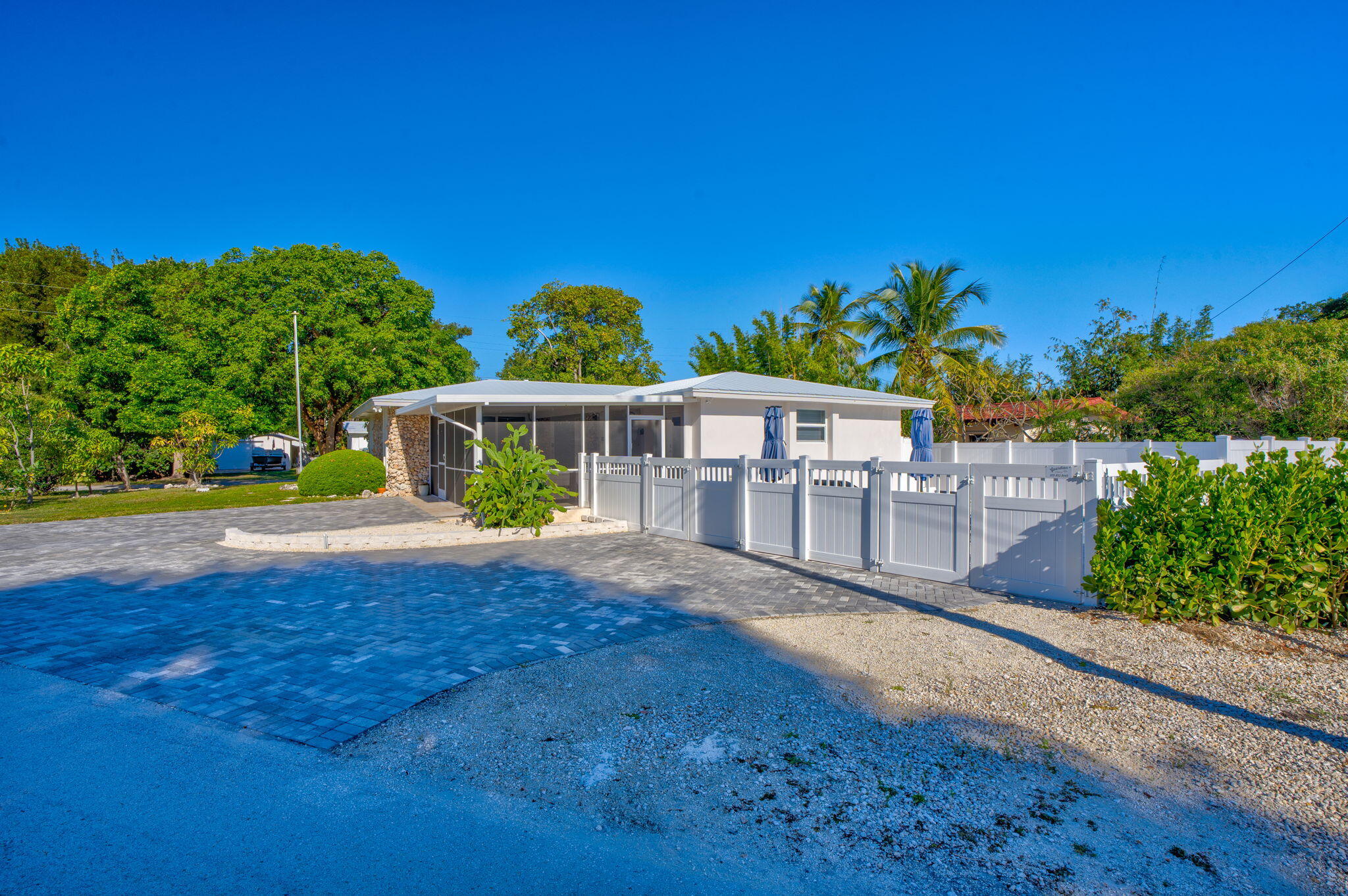 222 2nd Road Key Largo, FL 33037 - Photo 28 of 43 a view of yard with swimming pool and outdoor seating