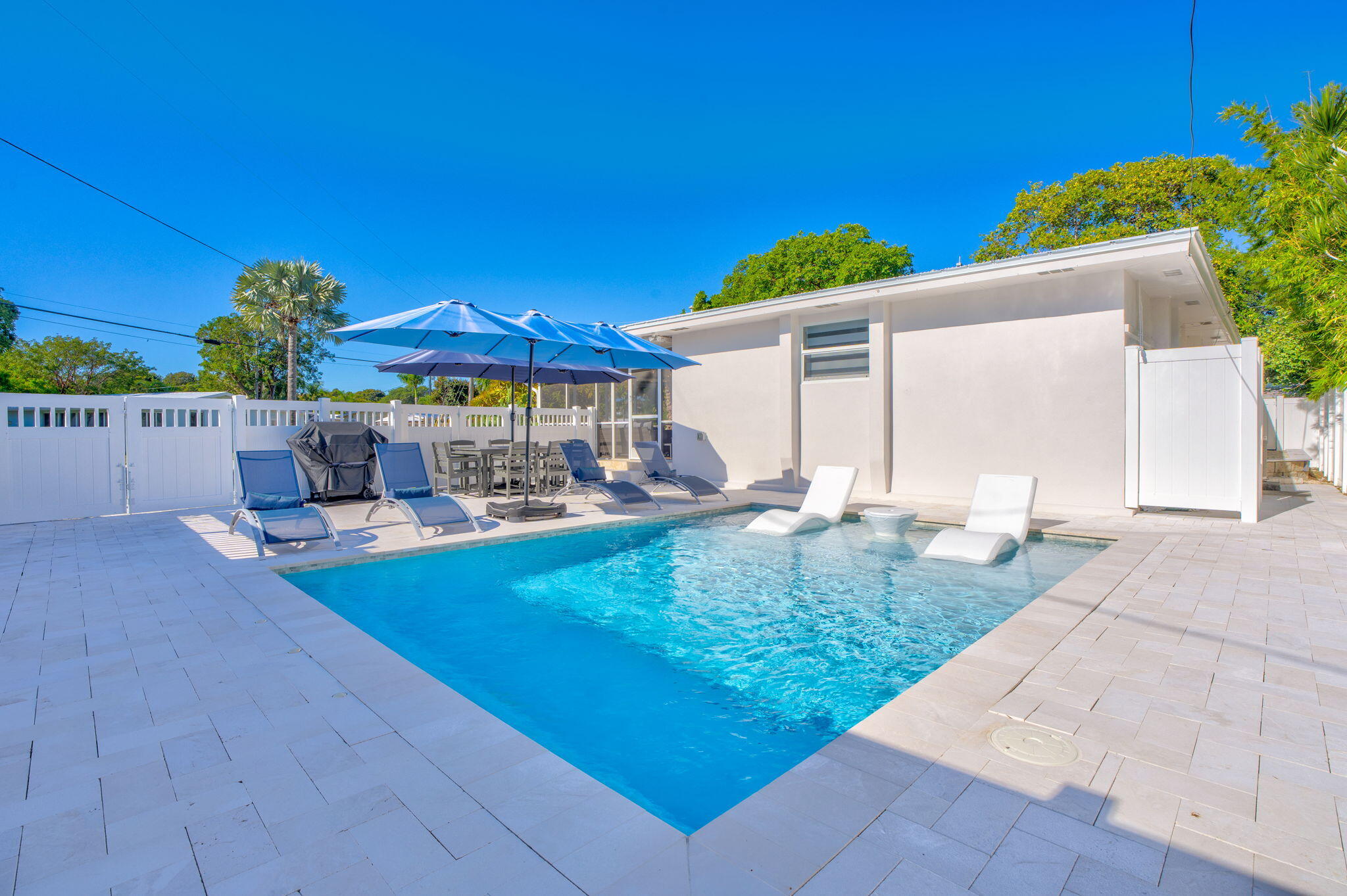 222 2nd Road Key Largo, FL 33037 - Photo 32 of 43 a view of swimming pool with outdoor seating and plants
