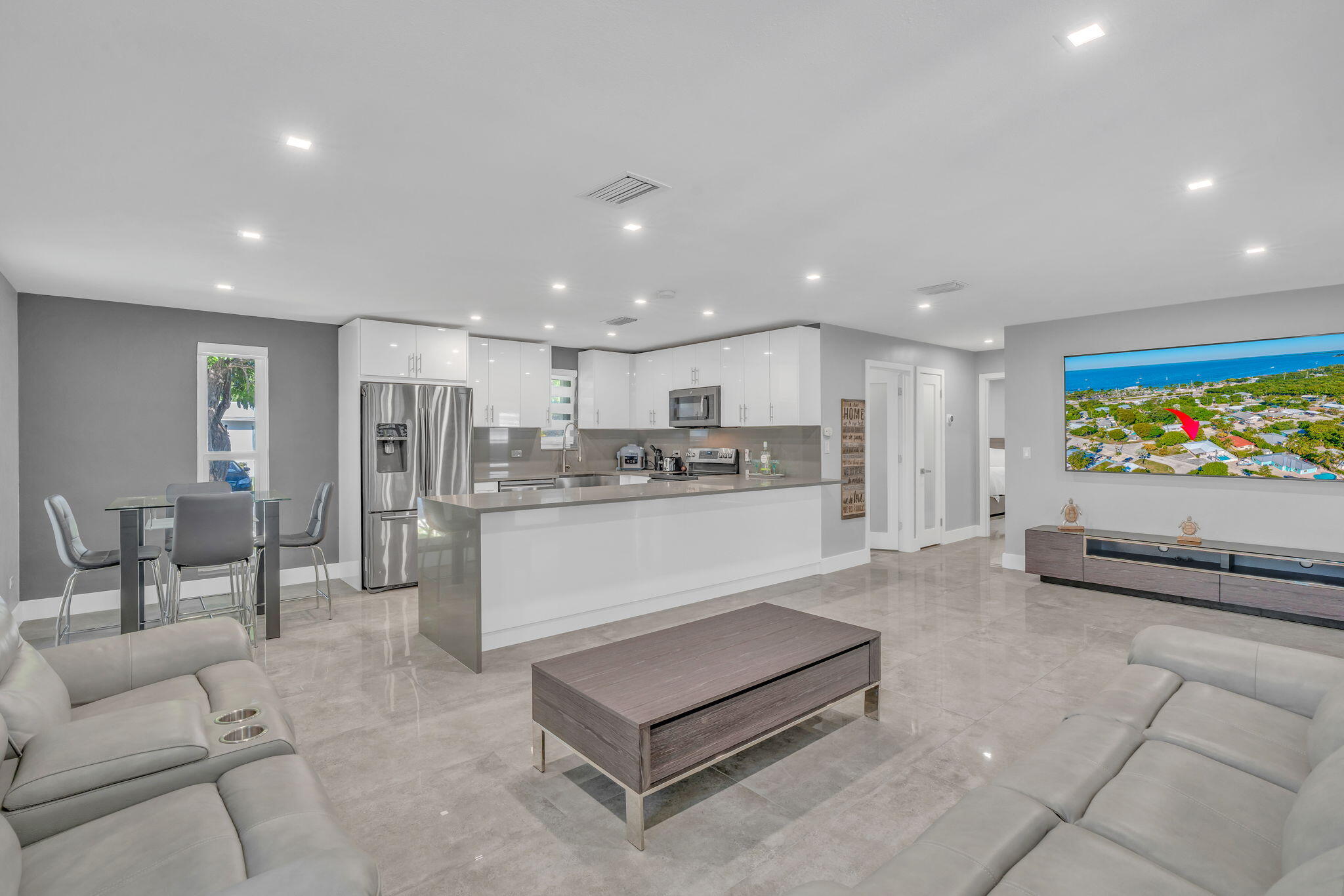 222 2nd Road Key Largo, FL 33037 - Photo 6 of 43 a living room with stainless steel appliances kitchen island granite countertop furniture and a couch