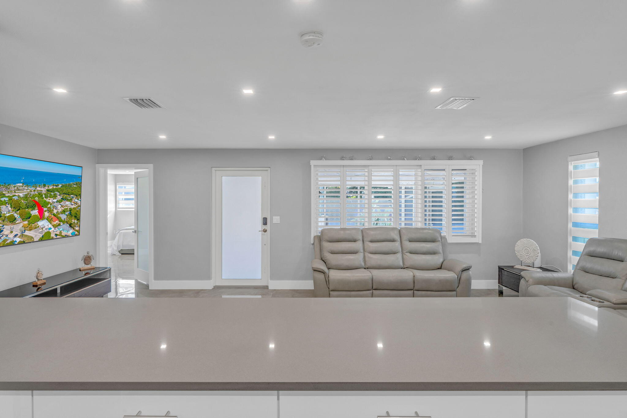 222 2nd Road Key Largo, FL 33037 - Photo 10 of 43 a living room with furniture and a flat screen tv
