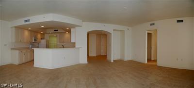2104 West First Street, Unit 1602 Fort Myers, FL 33901 - Photo 3 of 10 a view of a room with large windows