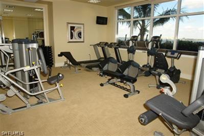 2104 West First Street, Unit 1602 Fort Myers, FL 33901 - Photo 10 of 10 a room with gym equipment and mirror