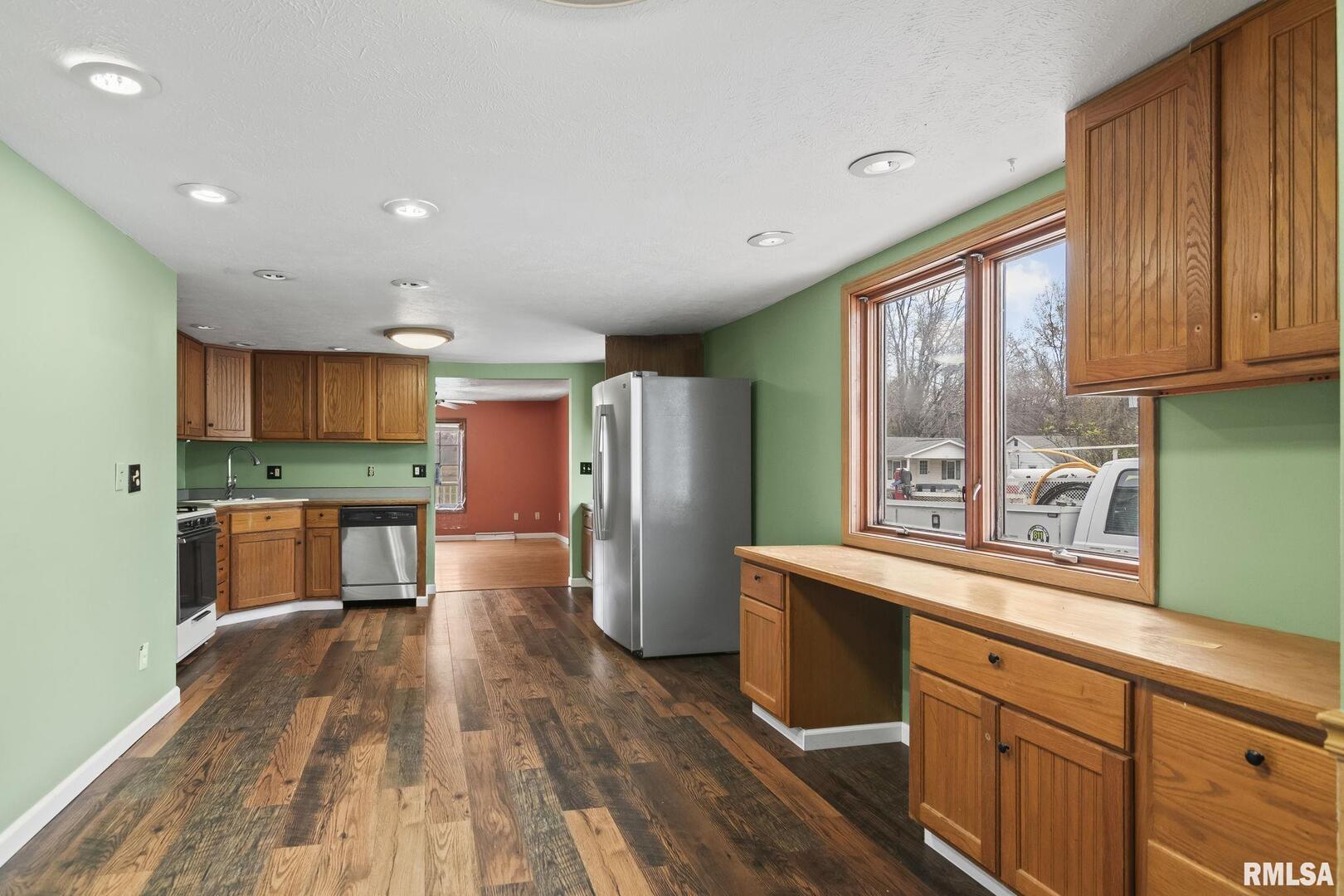 220 East Wilcox Street Springfield, IL 62707 - Photo 29 of 36 a kitchen with stainless steel appliances wooden floors and wooden cabinets
