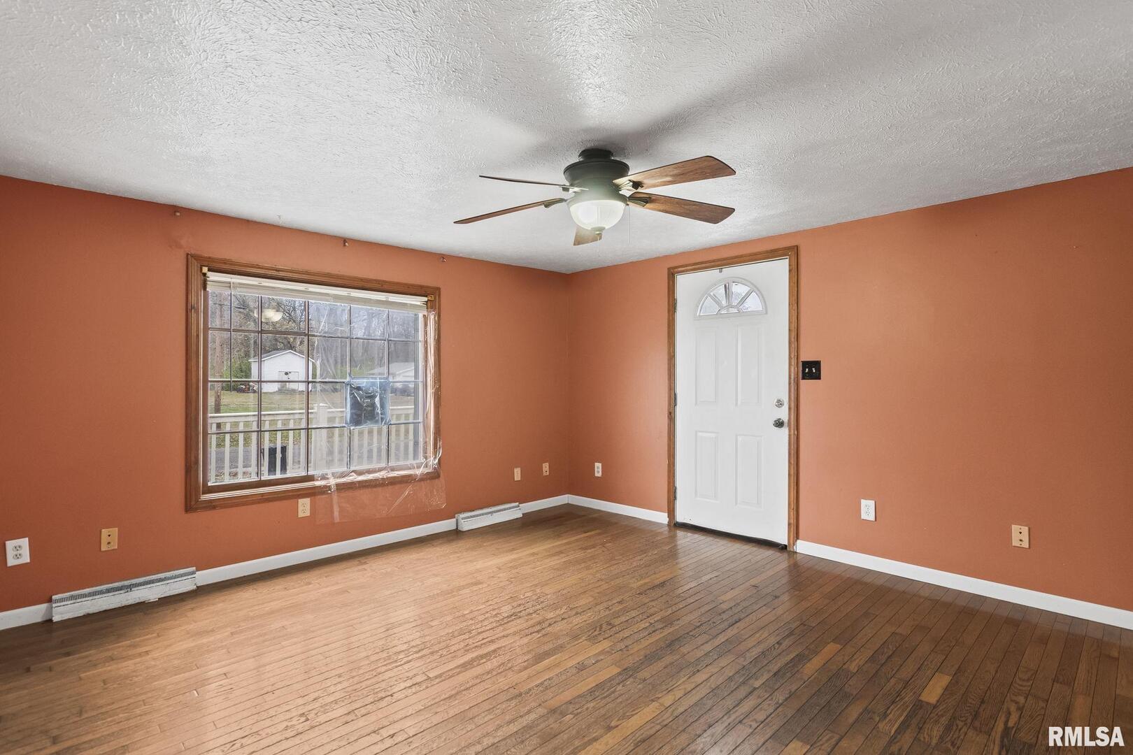 220 East Wilcox Street Springfield, IL 62707 - Photo 35 of 36 a view of an empty room with a window and wooden floor