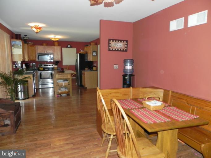 123 Quail Run Road Summit Point, WV 25446 - Photo 3 of 25 a dinning table and chairs in a room