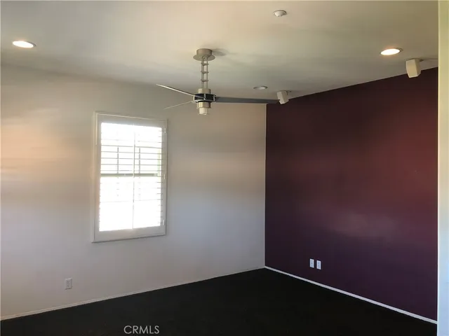 an empty room with a empty space and window