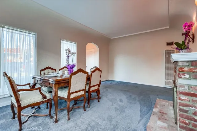a kitchen with stainless steel appliances granite countertop a sink and a refrigerator
