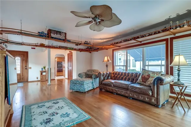 a view of a dinning table and chairs in patio of the house
