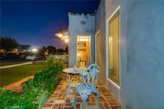 a view of a brick house with many windows