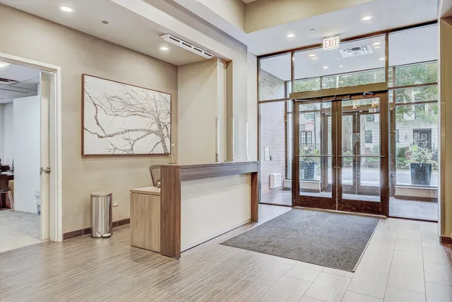 a open kitchen with stainless steel appliances granite countertop a stove and a refrigerator