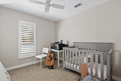 a bedroom with furniture and a window