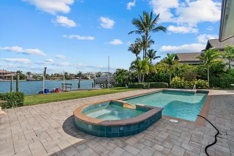 a view of a swimming pool with a yard