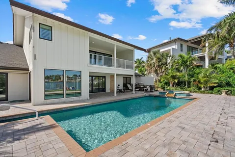 a front view of a house with a yard porch and outdoor seating