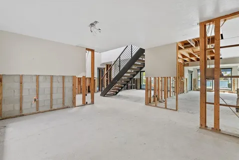a view of an empty room with stairs