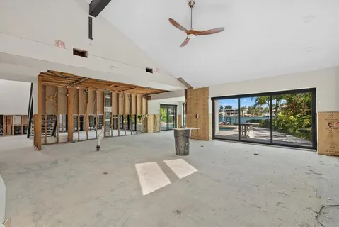 a big room with windows and a chandelier