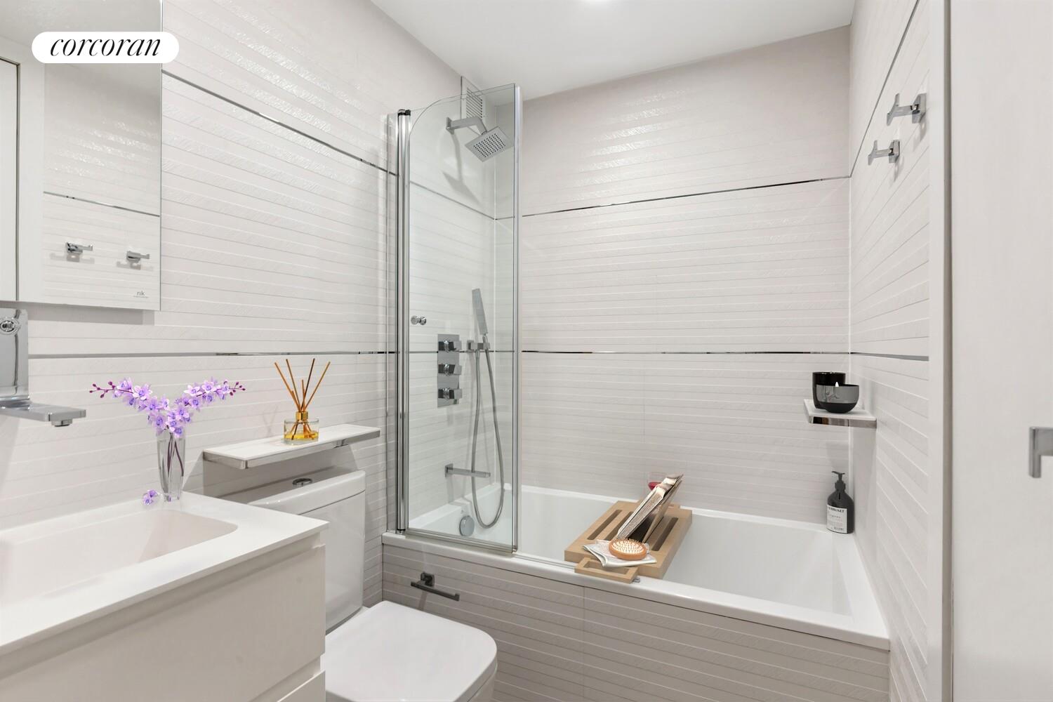 1991 Broadway, Unit 21A Manhattan, NY 10023 - Photo 11 of 13 a bathroom with a sink toilet and shower