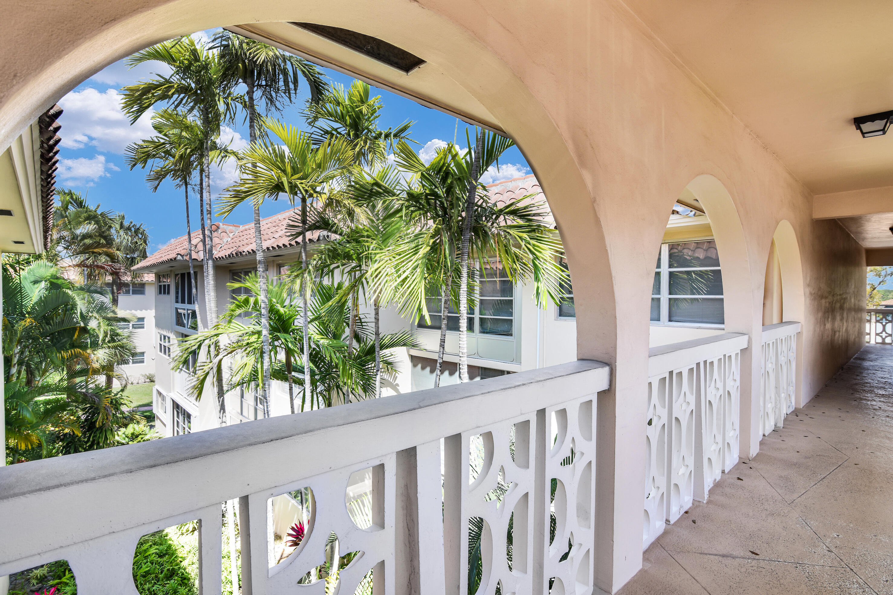 400 Northeast 20th Street, Unit B304 Boca Raton, FL 33431 - Photo 5 of 26 WELL-COVERED WALKWAYS