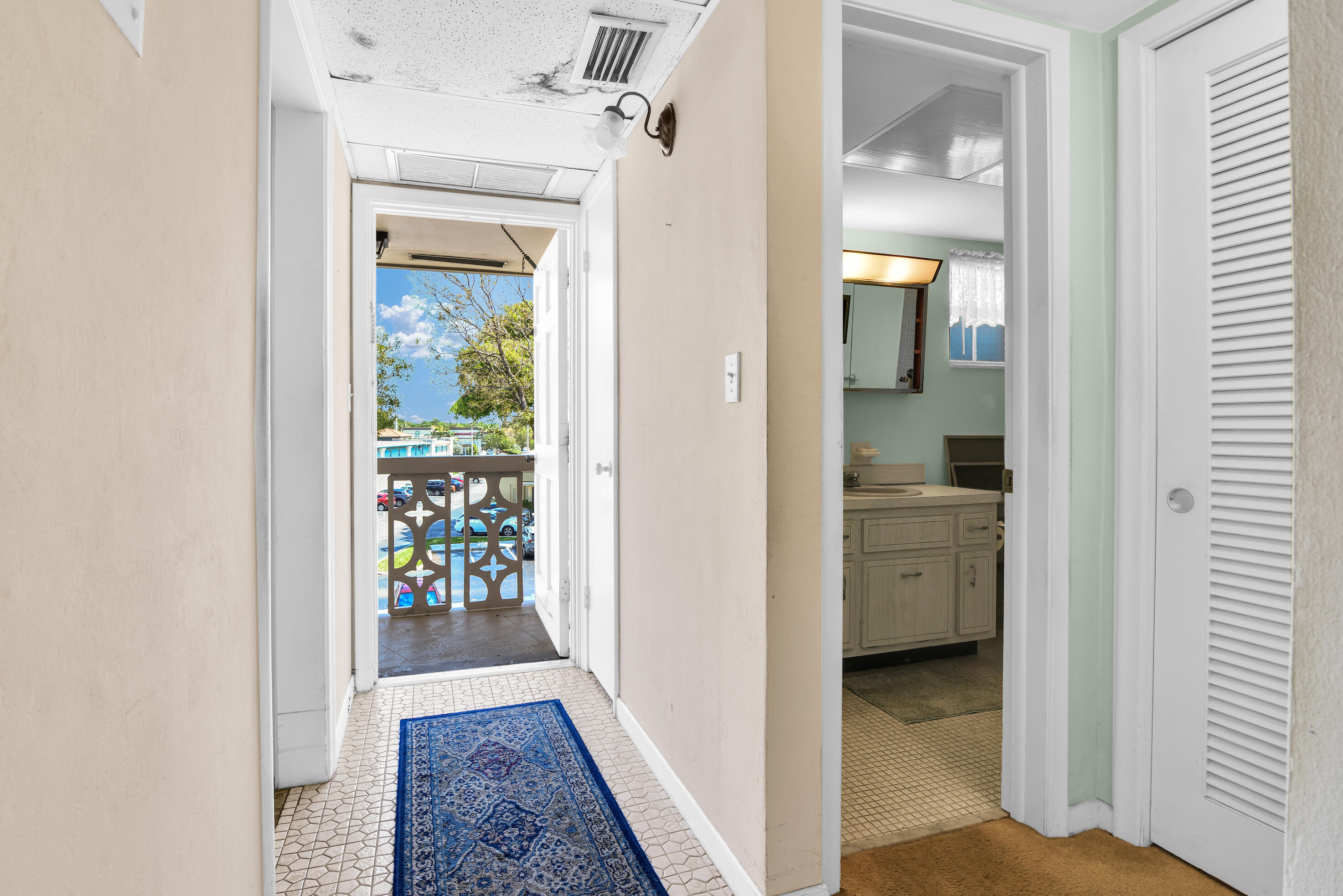 400 Northeast 20th Street, Unit B304 Boca Raton, FL 33431 - Photo 10 of 26 B304 HALL TO EXIT