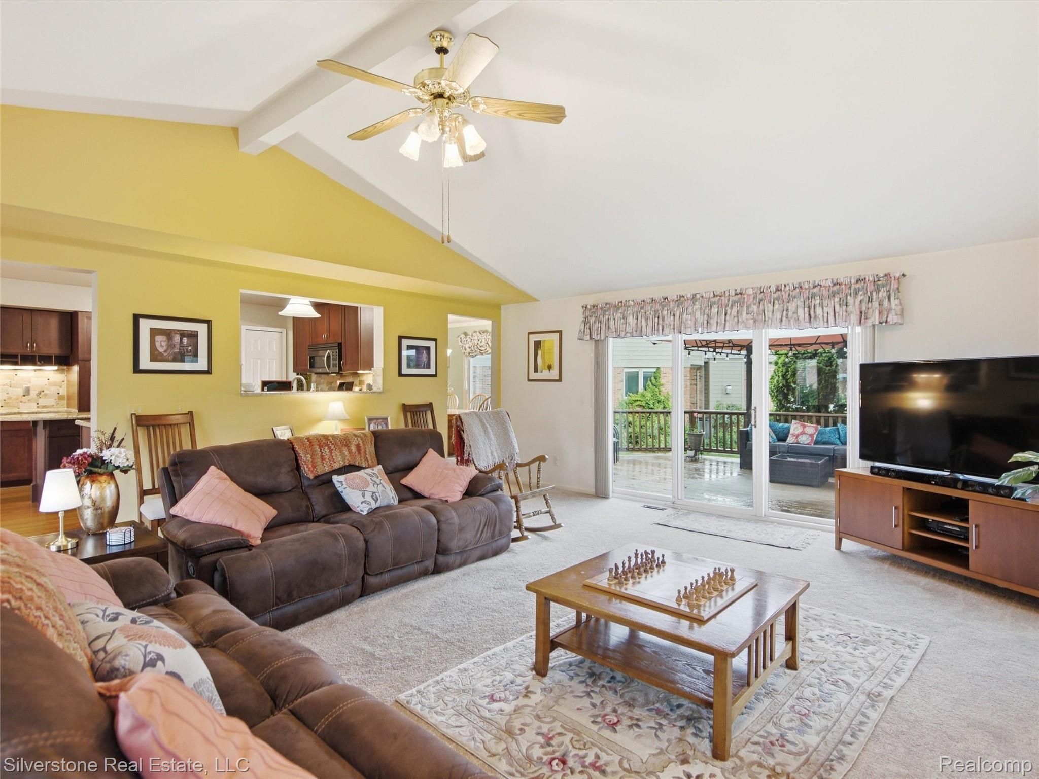 6577 Edith Court Troy, MI 48085 - Photo 15 of 61 Vaulted ceiling with exposed beams and a ceiling fan