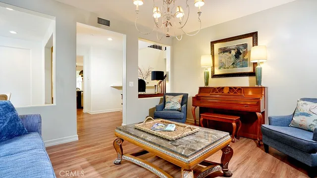 a view of balcony with chairs and iron fence