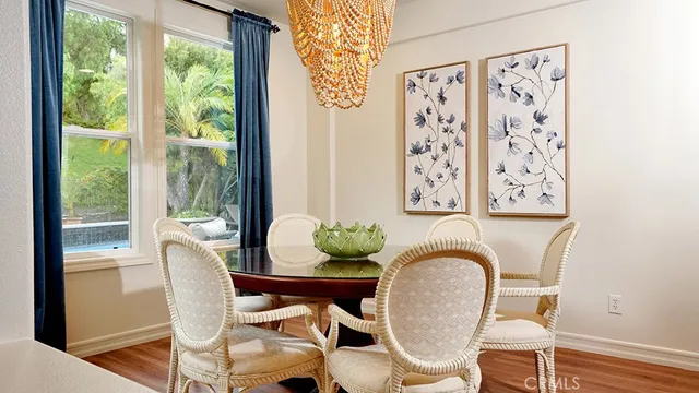 a view of swimming pool with seating area and trees around