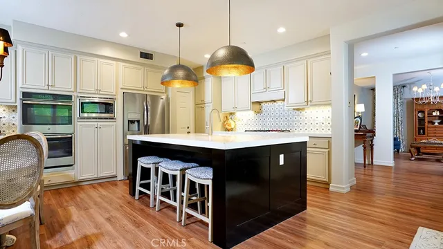 a view of swimming pool with lounge chair and trees