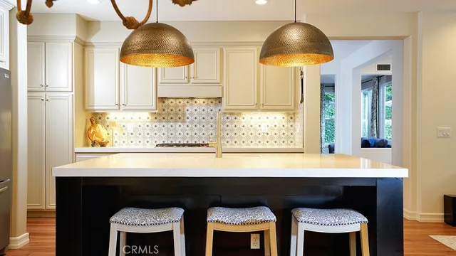 a view of a house with swimming pool and sitting area