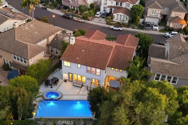 an aerial view of multiple houses with yard