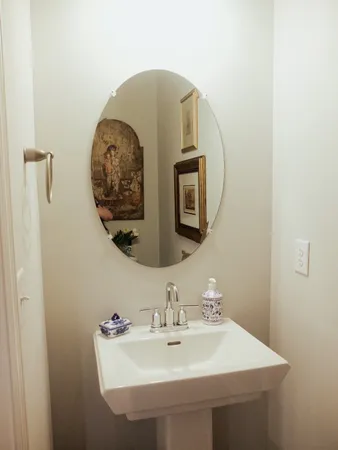 a bathroom with a sink and mirror