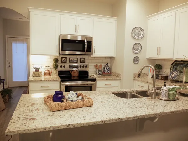 a kitchen with a stove and a sink