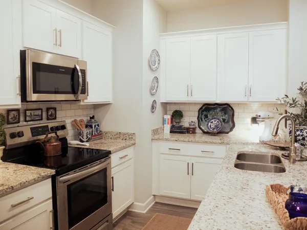 a kitchen with a stove and a microwave