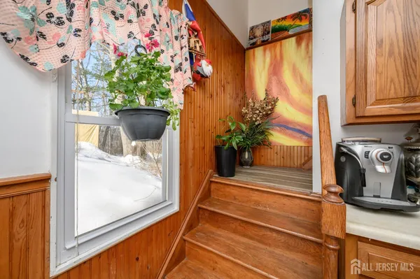 a view of a entryway with wooden floor and door