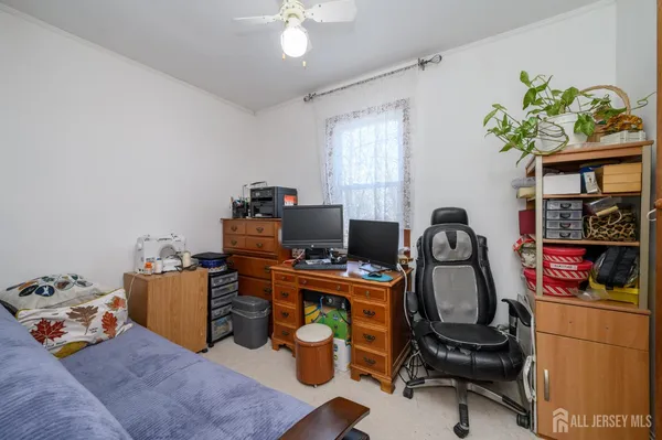 a workspace with furniture and a window