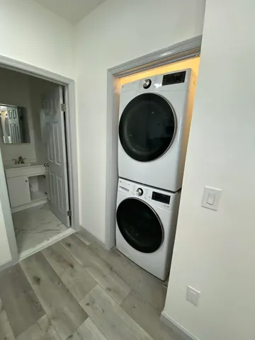 a view of a hallway with washer and dryer